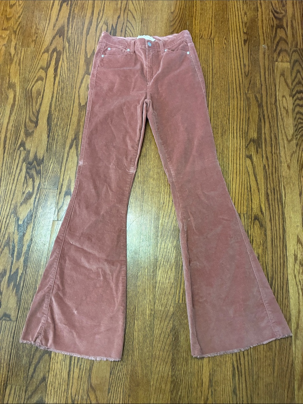 Altar'd State pink corduroy flare pants with a raw hem size 28 / 7